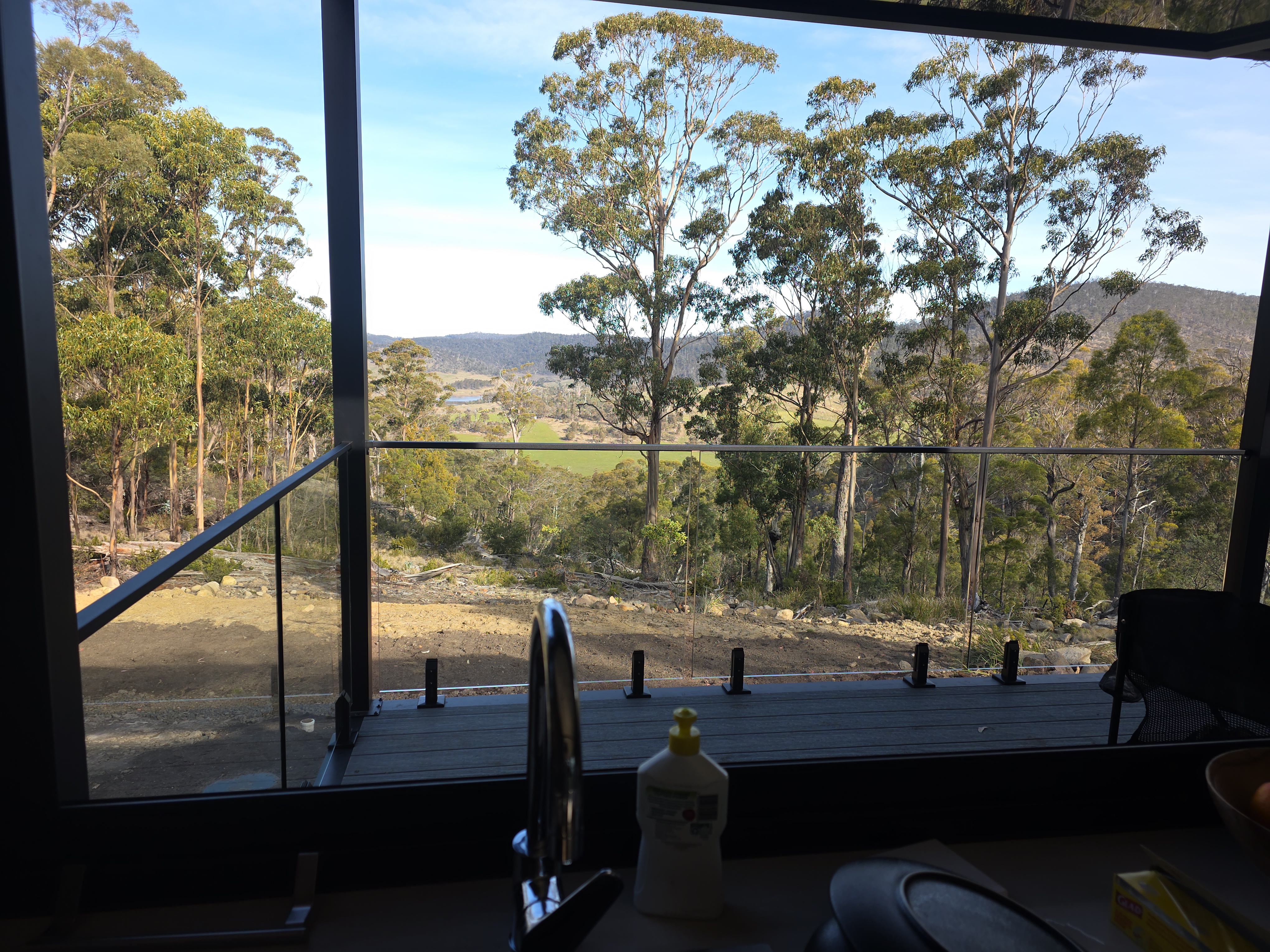Valley and bushland view through the pod's ridge-facing glazing